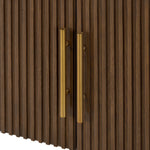 Featuring Fletcher Terra Brown Oak Media Console by Four Hands at Amethyst Home. Rich with reeding for texture and a linear look, this brown oak media console features four doors with brushed brass hardware and curved corners. Its top is a slab of bluestone, adding a striking material mix, while white mineral lines and natural variations mark the uniqueness of . Amethyst Home provides interior design, new home construction design consulting, vintage area rugs, and lighting in the Tampa metro area.