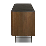 Featuring Fletcher Terra Brown Oak Media Console by Four Hands at Amethyst Home. Rich with reeding for texture and a linear look, this brown oak media console features four doors with brushed brass hardware and curved corners. Its top is a slab of bluestone, adding a striking material mix, while white mineral lines and natural variations mark the uniquenes. Amethyst Home provides interior design, new home construction design consulting, vintage area rugs, and lighting in the Washington metro area.