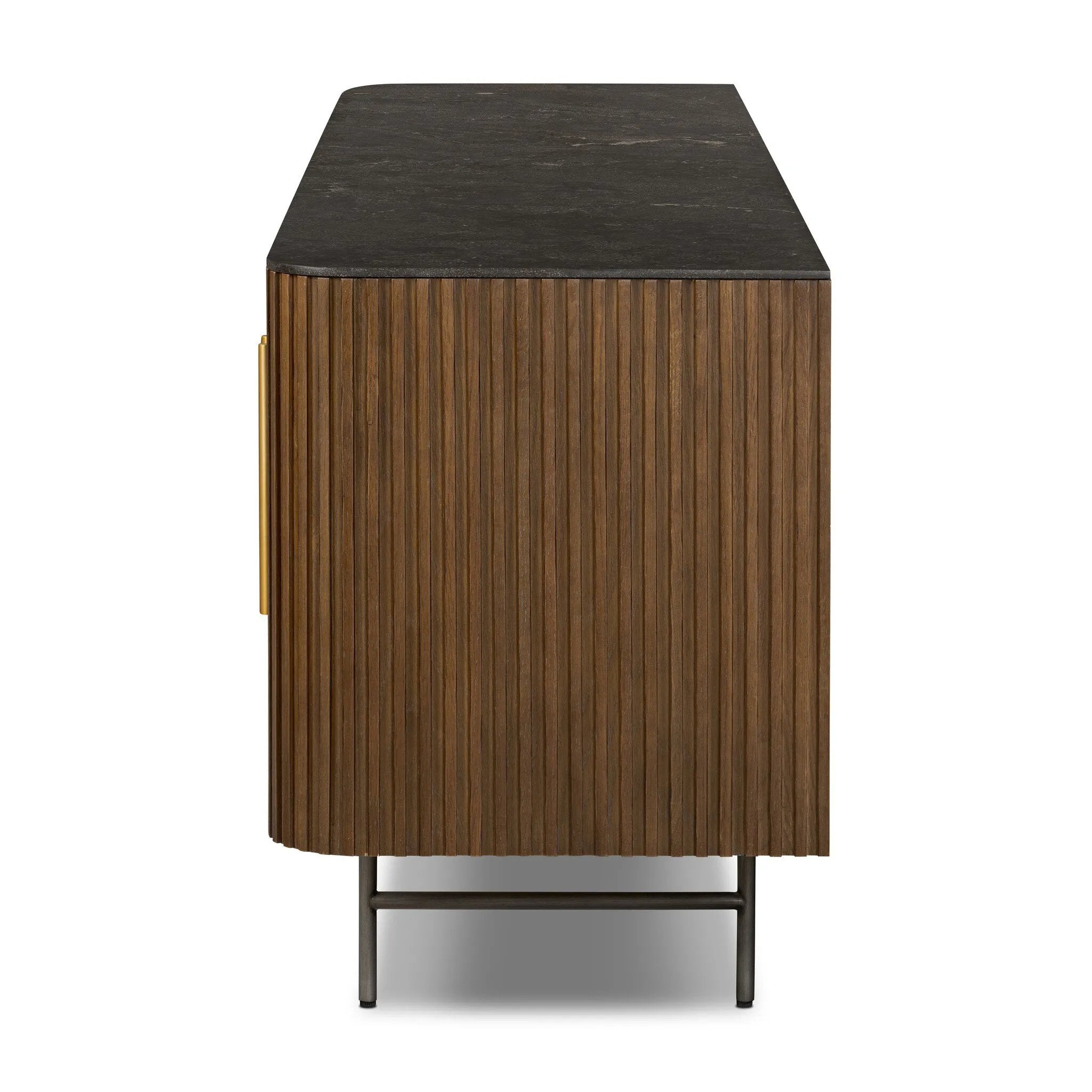 Featuring Fletcher Terra Brown Oak Media Console by Four Hands at Amethyst Home. Rich with reeding for texture and a linear look, this brown oak media console features four doors with brushed brass hardware and curved corners. Its top is a slab of bluestone, adding a striking material mix, while white mineral lines and natural variations mark the uniquenes. Amethyst Home provides interior design, new home construction design consulting, vintage area rugs, and lighting in the Washington metro area.