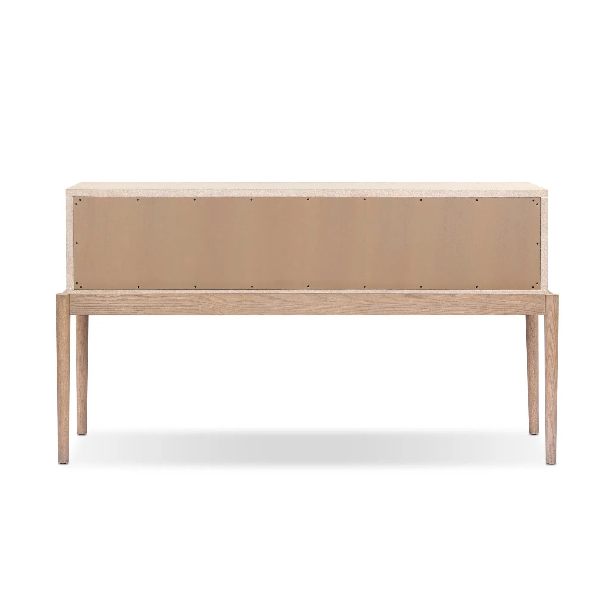 A soft statement console table with ample storage, inspired by a dresser silhouette. The elevated case is wrapped in painted linen and sits atop an oak base for a light and airy look Amethyst Home provides interior design, new home construction design consulting, vintage area rugs, and lighting in the Calabasas metro area.