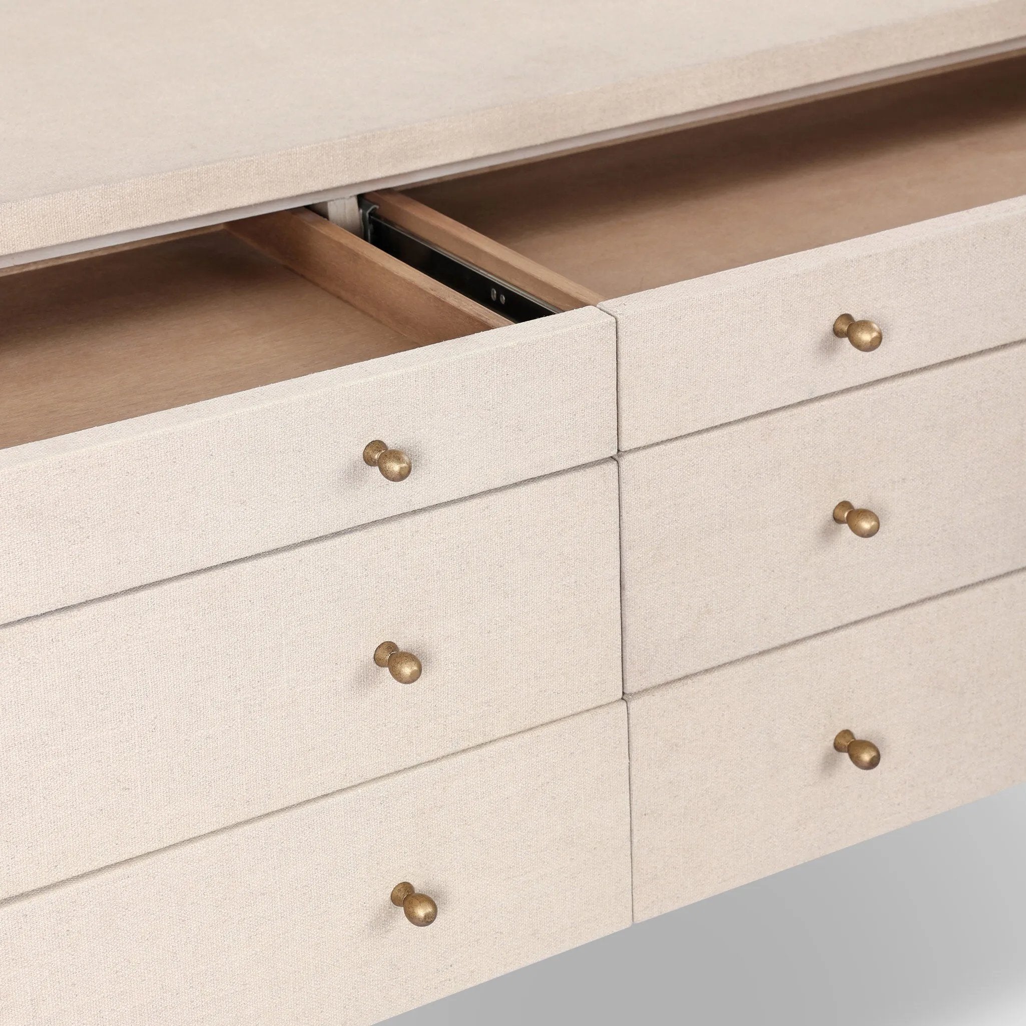 A soft statement console table with ample storage, inspired by a dresser silhouette. The elevated case is wrapped in painted linen and sits atop an oak base for a light and airy look Amethyst Home provides interior design, new home construction design consulting, vintage area rugs, and lighting in the Miami metro area.