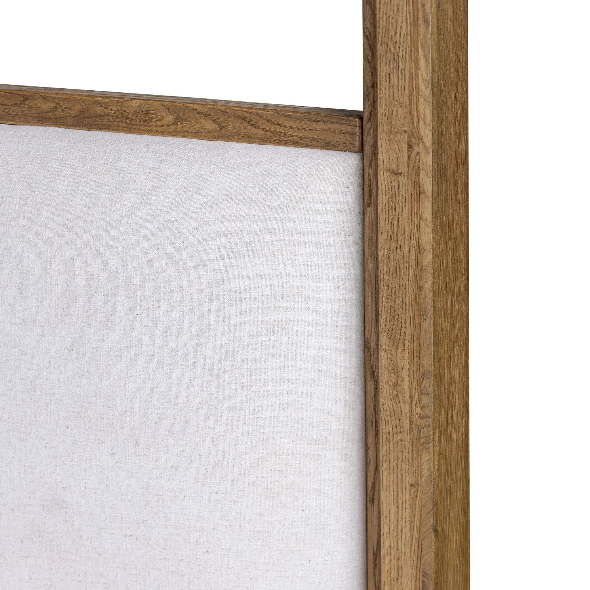 Minimalist and modern, this platform-style canopy bed is framed to a low profile and softened with an upholstered headboard. The character-rich oak's rounded corners and light brown finish add to the bed's fresh appeal Amethyst Home provides interior design, new home construction design consulting, vintage area rugs, and lighting in the Dallas metro area.