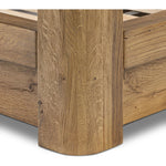 Minimalist and modern, this platform-style canopy bed is framed to a low profile and softened with an upholstered headboard.