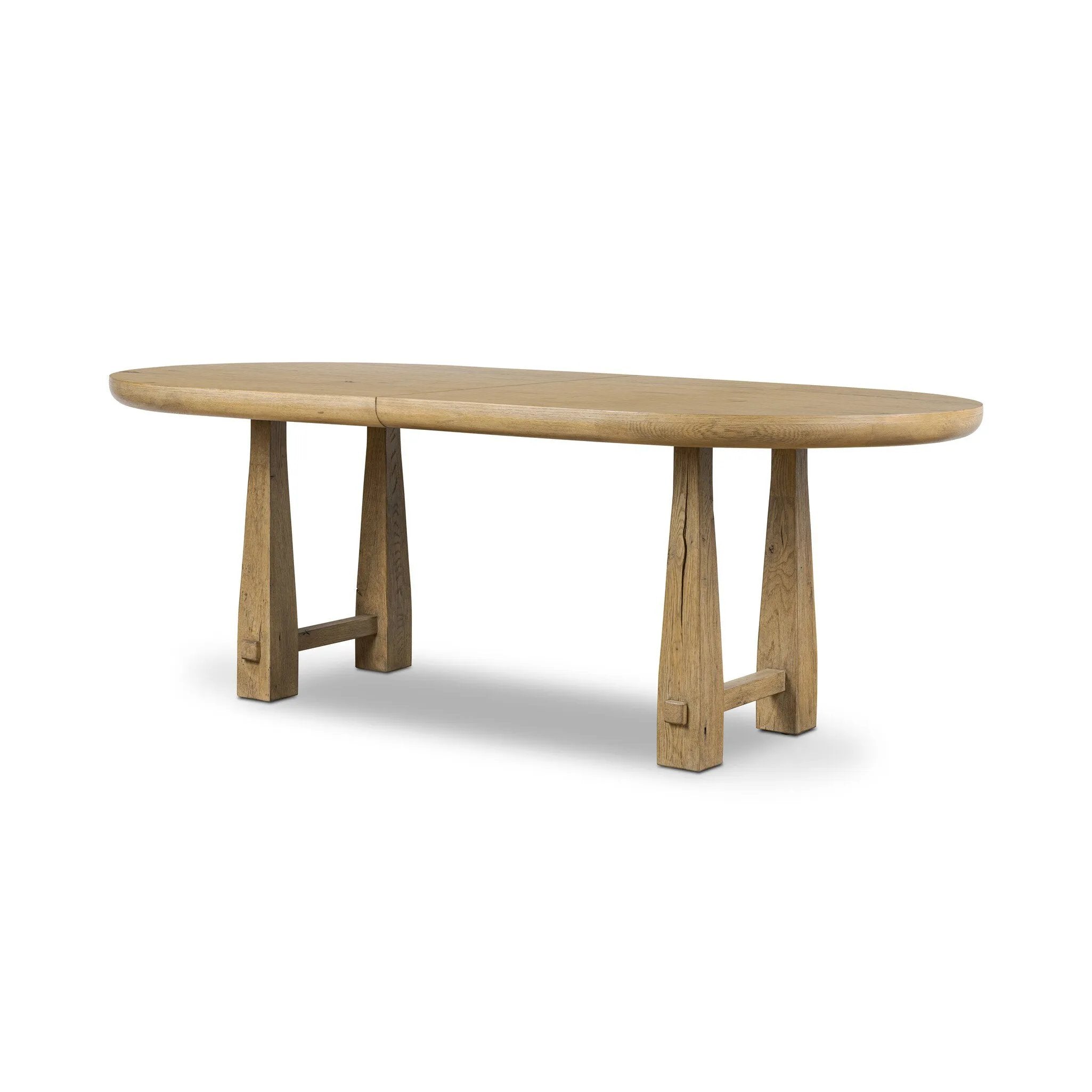 Make space to gather around. This extendable dining table is crafted from drifted oak veneer with a semi-trestle base, thick legs and an oval-shaped surface. The extension expands the table from 84" to a roomier 104" Amethyst Home provides interior design, new home construction design consulting, vintage area rugs, and lighting in the Kansas City metro area.
