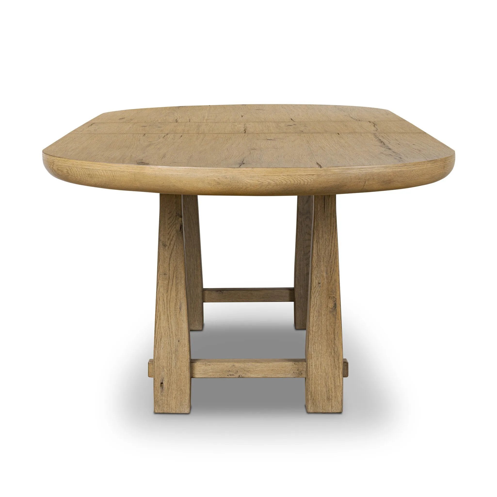 Make space to gather around. This extendable dining table is crafted from drifted oak veneer with a semi-trestle base, thick legs and an oval-shaped surface. The extension expands the table from 84" to a roomier 104" Amethyst Home provides interior design, new home construction design consulting, vintage area rugs, and lighting in the Tampa metro area.