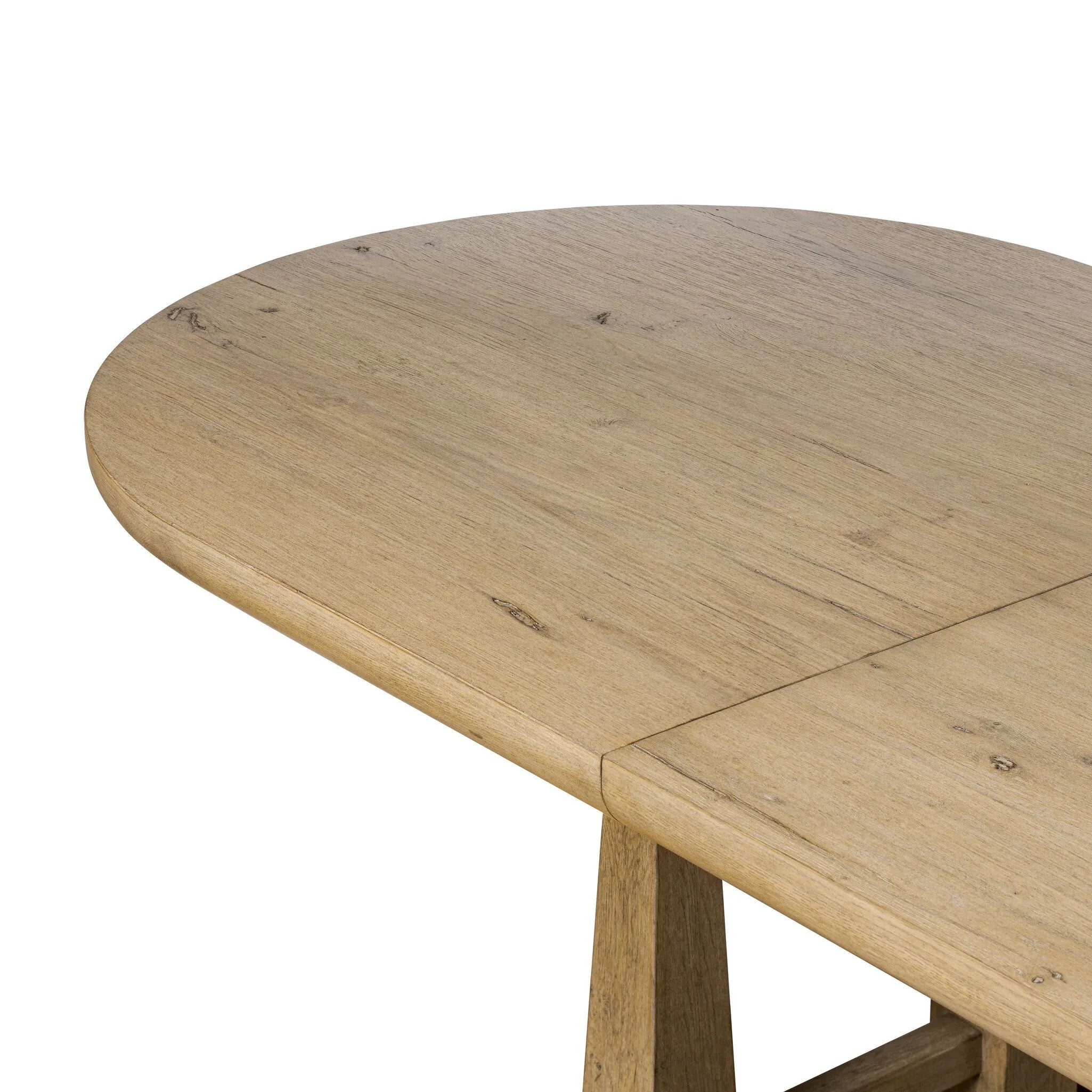 Make space to gather around. This extendable dining table is crafted from drifted oak veneer with a semi-trestle base, thick legs and an oval-shaped surface. The extension expands the table from 84" to a roomier 104" Amethyst Home provides interior design, new home construction design consulting, vintage area rugs, and lighting in the Winter Garden metro area.
