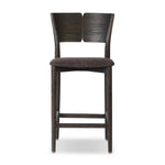 Inspired by simple Scandinavian styling, a dark-finished parawood stool's slit-back metal inlay adds a decorative touch. Easy curves from bent wood give a smooth silhouette. Sized for the counter and upholstered with a thin seat cushion upholstered in black performance fabric, perfect for dining or entertaining. Amethyst Home provides interior design, new home construction design consulting, vintage area rugs, and lighting in the Monterey metro area.