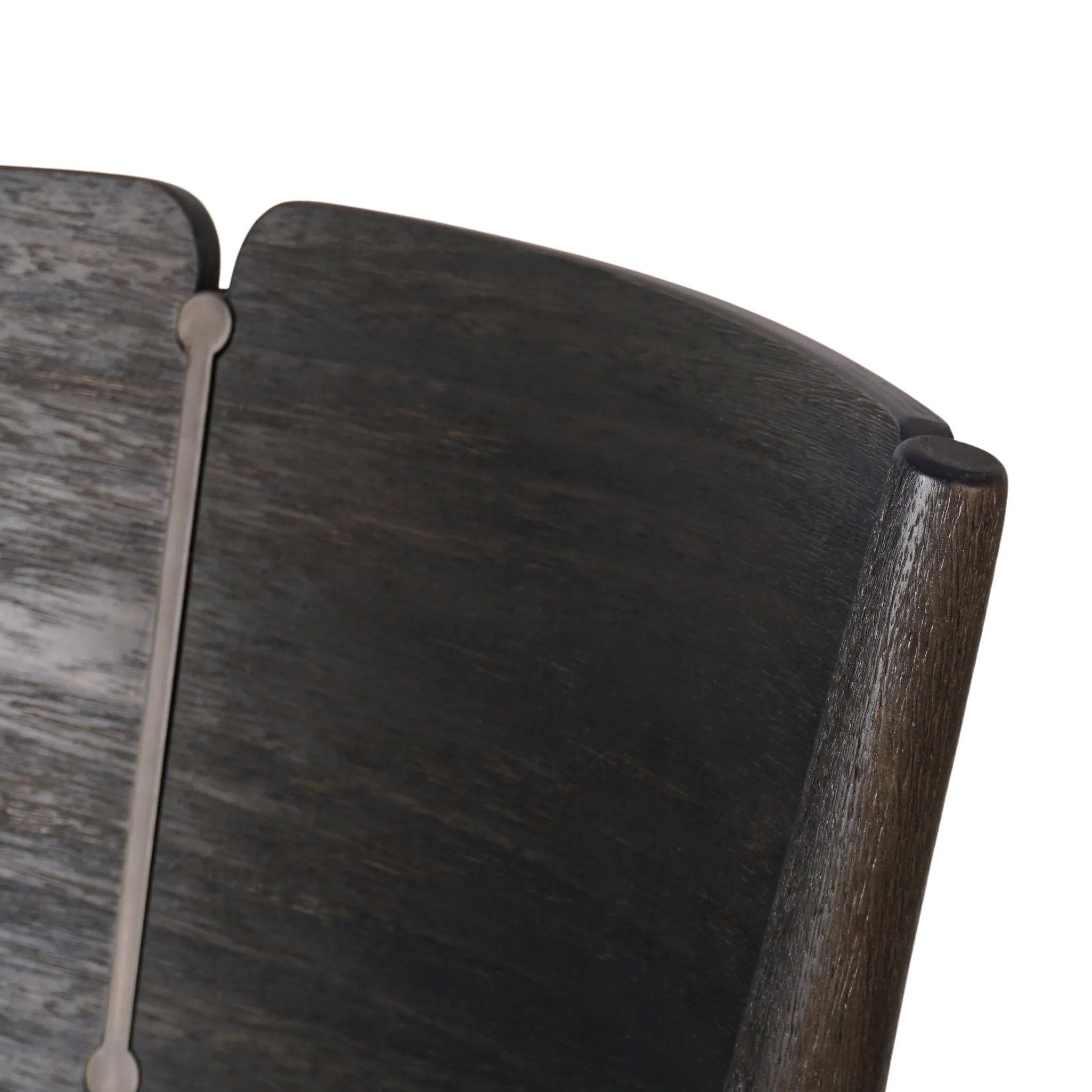 Inspired by simple Scandinavian styling, a dark-finished parawood stool's slit-back metal inlay adds a decorative touch. Easy curves from bent wood give a smooth silhouette. Sized for the counter and upholstered with a thin seat cushion upholstered in black performance fabric, perfect for dining or entertaining. Amethyst Home provides interior design, new home construction design consulting, vintage area rugs, and lighting in the Newport Beach metro area.
