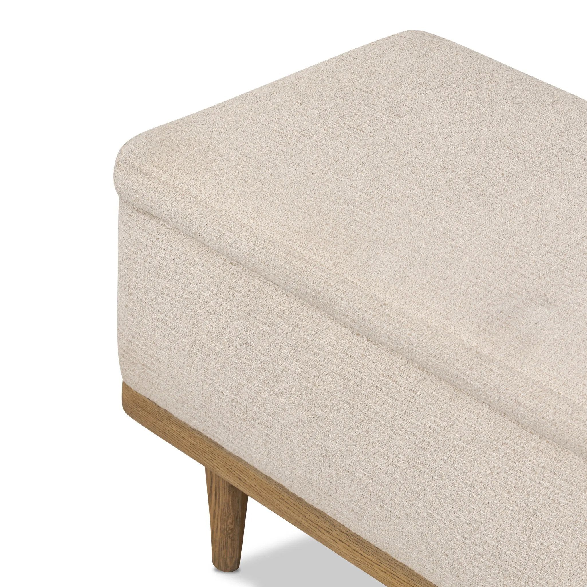 Wrapped in textural cream performance fabric, this spacious trunk doubles as seating at the foot of the bed — or anywhere. Store extra blankets, linens and more. Crafted from oak, the frame and tapered legs with Deco vibes are finished in a worn oak finish. Amethyst Home provides interior design, new home construction design consulting, vintage area rugs, and lighting in the Dallas metro area.