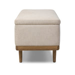 Wrapped in textural cream performance fabric, this spacious trunk doubles as seating at the foot of the bed — or anywhere. Store extra blankets, linens and more. Crafted from oak, the frame and tapered legs with Deco vibes are finished in a worn oak finish. Amethyst Home provides interior design, new home construction design consulting, vintage area rugs, and lighting in the Kansas City metro area.