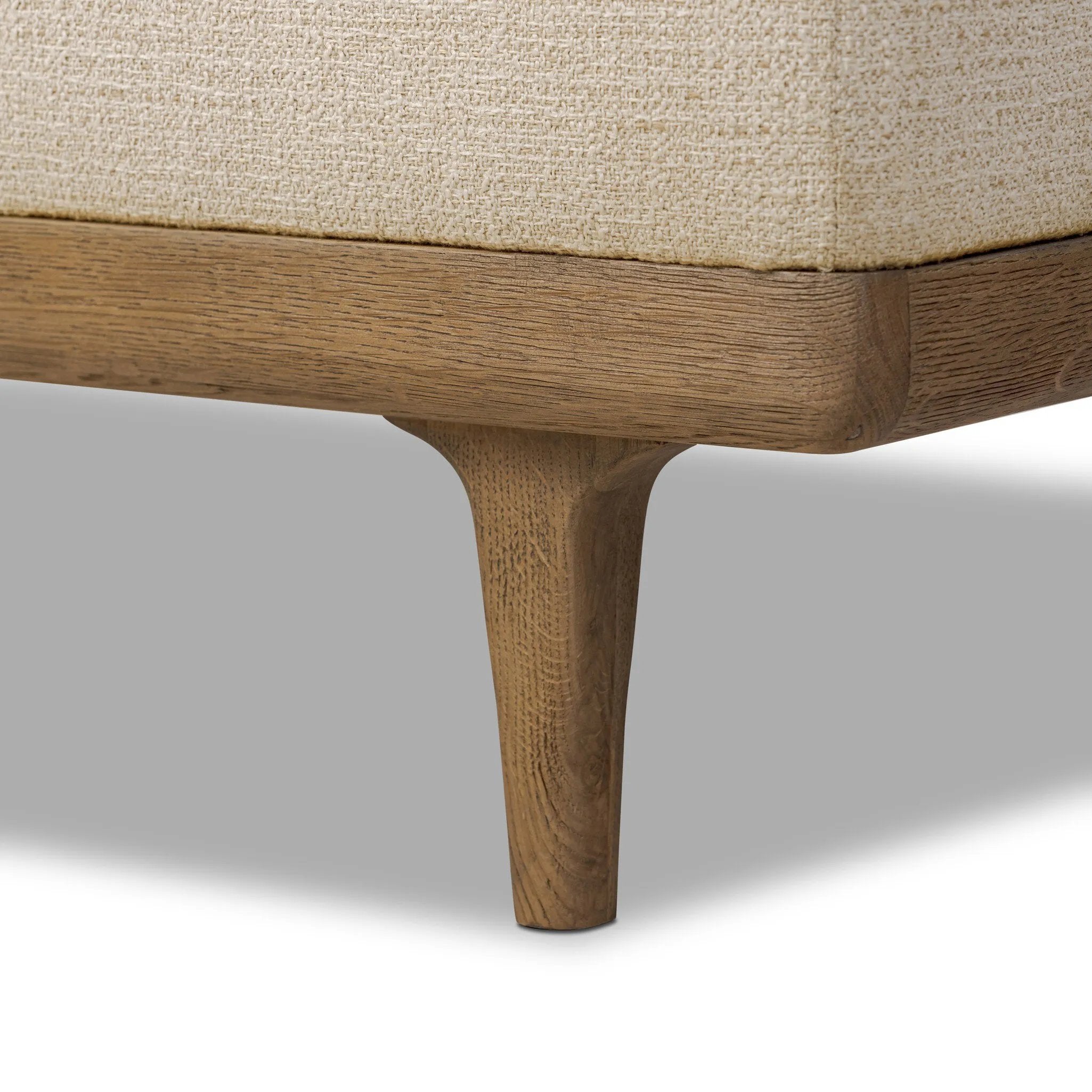 Wrapped in textural cream performance fabric, this spacious trunk doubles as seating at the foot of the bed — or anywhere. Store extra blankets, linens and more. Crafted from oak, the frame and tapered legs with Deco vibes are finished in a worn oak finish. Amethyst Home provides interior design, new home construction design consulting, vintage area rugs, and lighting in the Monterey metro area.