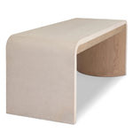 A thick layer of beige painted linen cascades this desk's soft waterfall shape in an eye-catching combination of texture. Crafted atop a mahogany and oak veneer base with rounded corners, this hardworking piece elevates the home-office workspace Amethyst Home provides interior design, new home construction design consulting, vintage area rugs, and lighting in the Portland metro area.