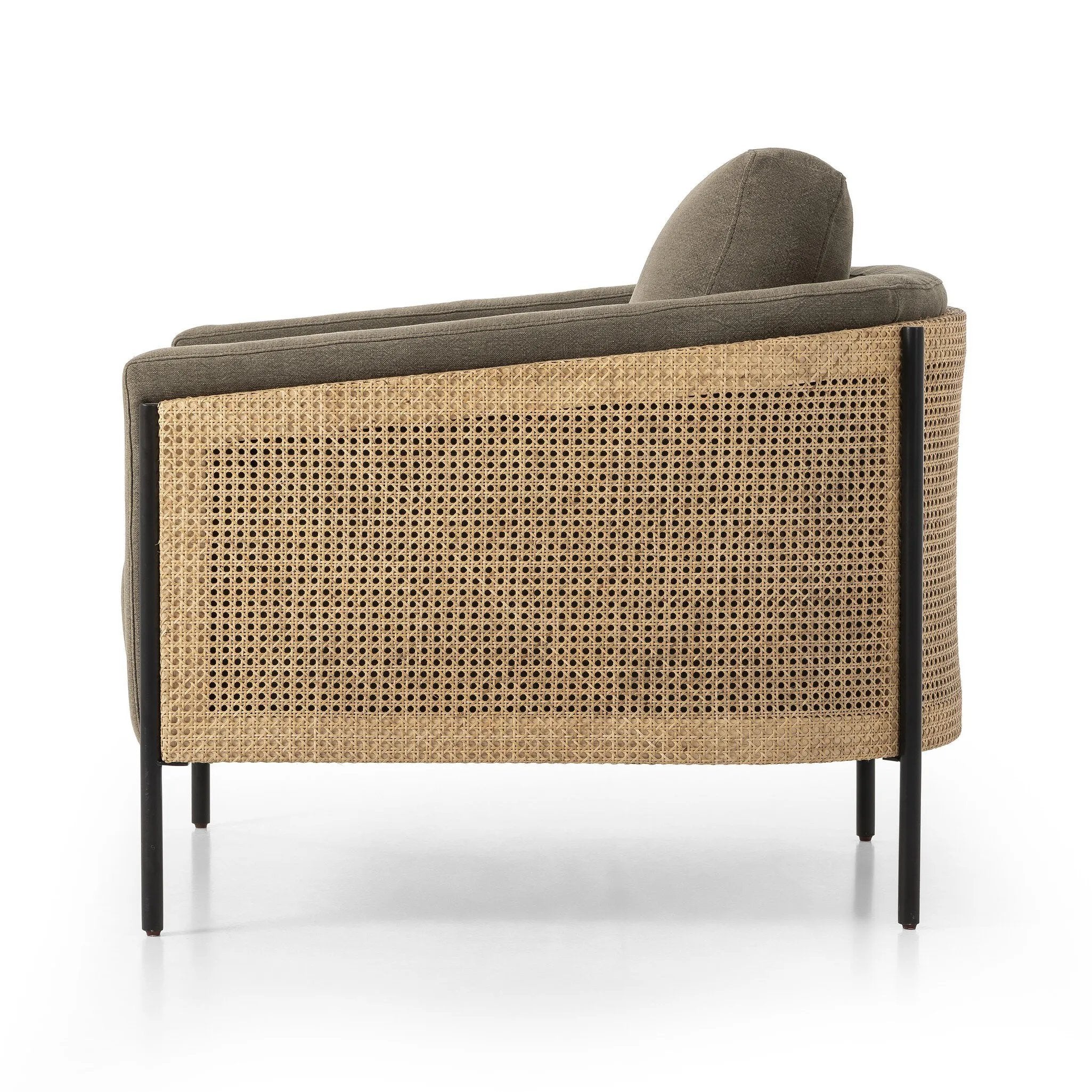 On-trend and expertly tailored, a texture-driven chair is upholstered in an olive flax/linen blend and wrapped with natural rattan, with linear iron legs finished in a complementary gunmetal Amethyst Home provides interior design, new home construction design consulting, vintage area rugs, and lighting in the Winter Garden metro area.