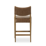 A fresh take on midcentury styling, perfectly sized for the counter. Supportive back and seat cushions are upholstered in a soft, neutral fabric and framed out by toasted solid oak Amethyst Home provides interior design, new home construction design consulting, vintage area rugs, and lighting in the Nashville metro area.