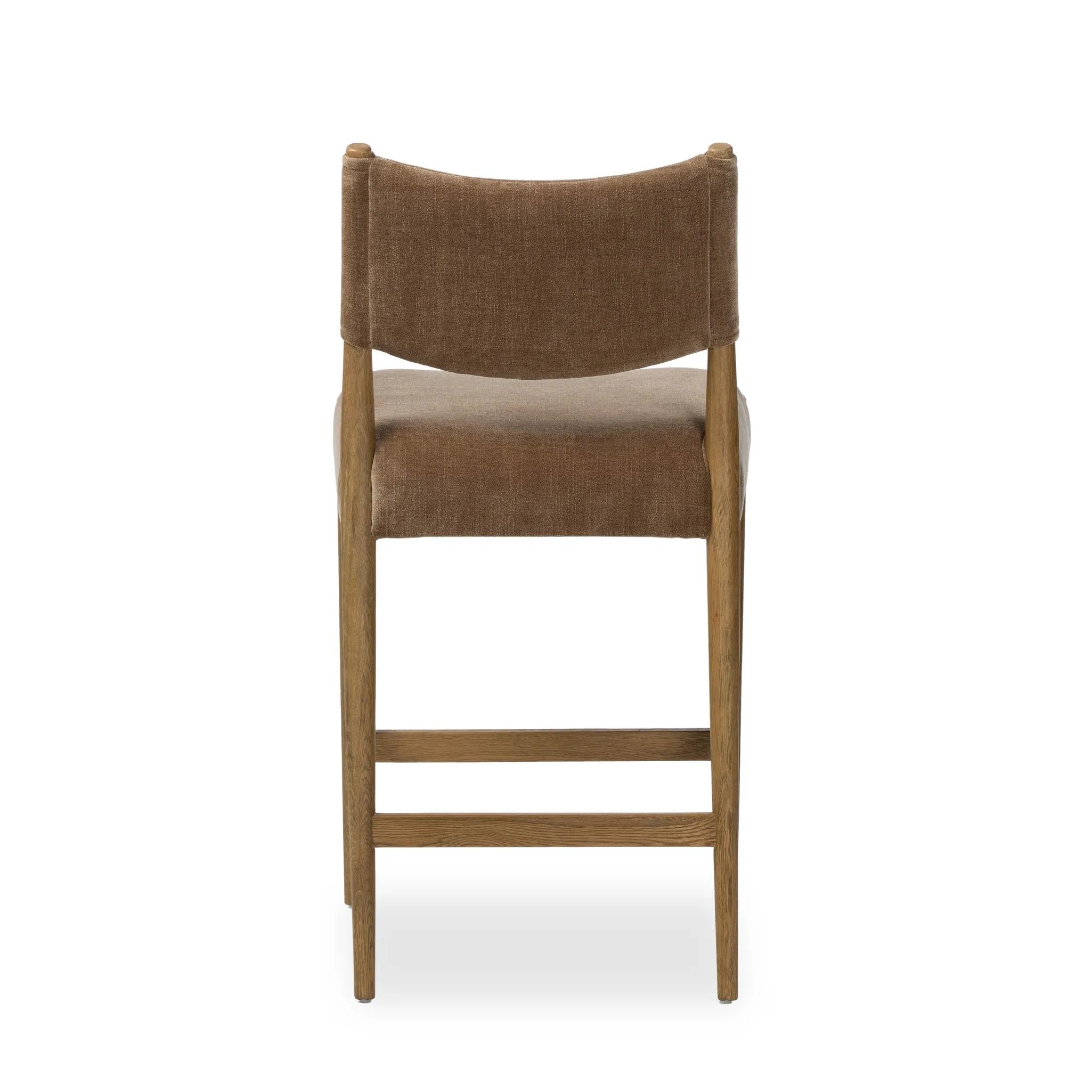 A fresh take on midcentury styling, perfectly sized for the counter. Supportive back and seat cushions are upholstered in a soft, neutral fabric and framed out by toasted solid oak Amethyst Home provides interior design, new home construction design consulting, vintage area rugs, and lighting in the Nashville metro area.