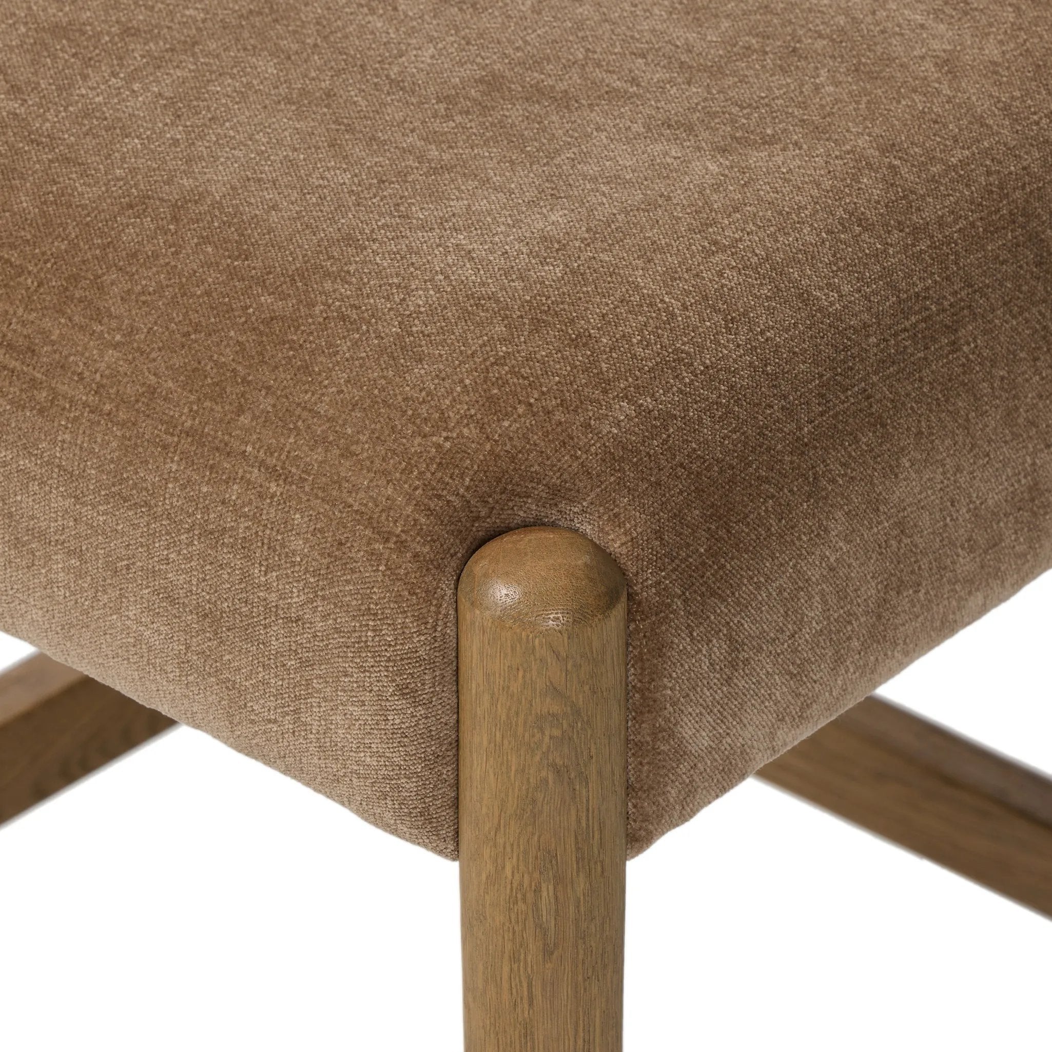 A fresh take on midcentury styling, perfectly sized for the counter. Supportive back and seat cushions are upholstered in a soft, neutral fabric and framed out by toasted solid oak Amethyst Home provides interior design, new home construction design consulting, vintage area rugs, and lighting in the Newport Beach metro area.