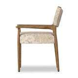 A midcentury-inspired piece brought to modern speed. A supportive, sling-style back and seat cushion are upholstered in a soft, velvety fabric, with toasted oak arms prime for the head of the table Amethyst Home provides interior design, new home construction design consulting, vintage area rugs, and lighting in the Salt Lake City metro area.