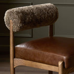 Featuring Jazelle Taupe Shearling Counter Stool by Four Hands at Amethyst Home. Bring mixed materials to the counter. Solid oak, top-grain leather and soft shearling fuse for a playful update to midcentury and Seventies styling. Overall Dimensions: 22.25"w x 25.75"d x 36.50"h. Amethyst Home provides interior design, new home construction design consulting, vintage area rugs, and lighting in the Laguna Beach metro area.