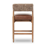 Featuring Jazelle Taupe Shearling Counter Stool by Four Hands at Amethyst Home. Bring mixed materials to the counter. Solid oak, top-grain leather and soft shearling fuse for a playful update to midcentury and Seventies styling. Overall Dimensions: 22.25"w x 25.75"d x 36.50"h. Amethyst Home provides interior design, new home construction design consulting, vintage area rugs, and lighting in the Nashville metro area.
