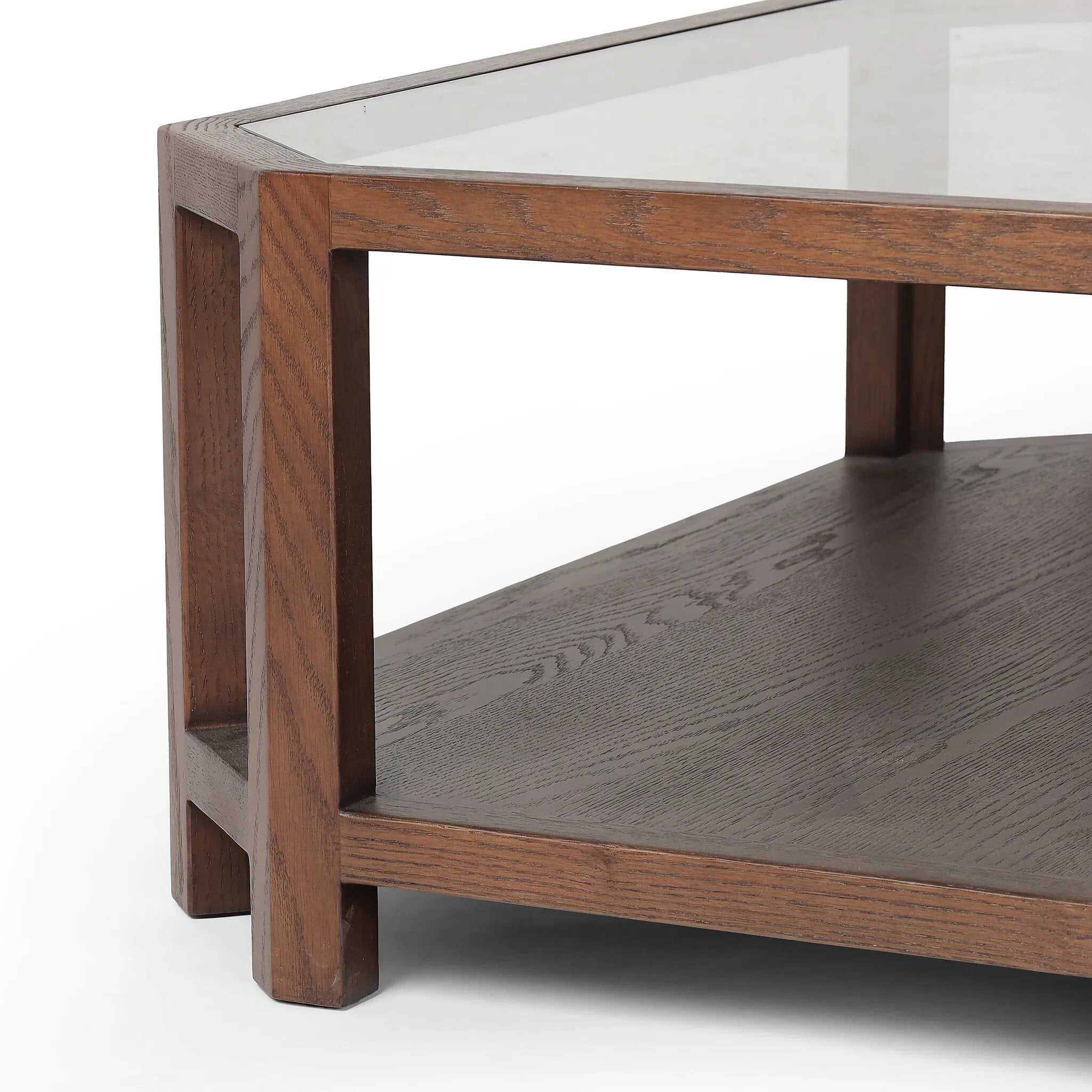 Featuring Jenzen Tempered Glass Coffee Table by Four Hands at Amethyst Home. Mix materials for a timeless look. Warm, brown oak shapes a unique octagon frame for a tempered glass top. Lower open shelving brings bonus storage and display options to your living space. Overall Dimensions: 48.00"w x 48.00"d x 16.50"h. Amethyst Home provides interior design, new home construction design consulting, vintage area rugs, and lighting in the Austin metro area.