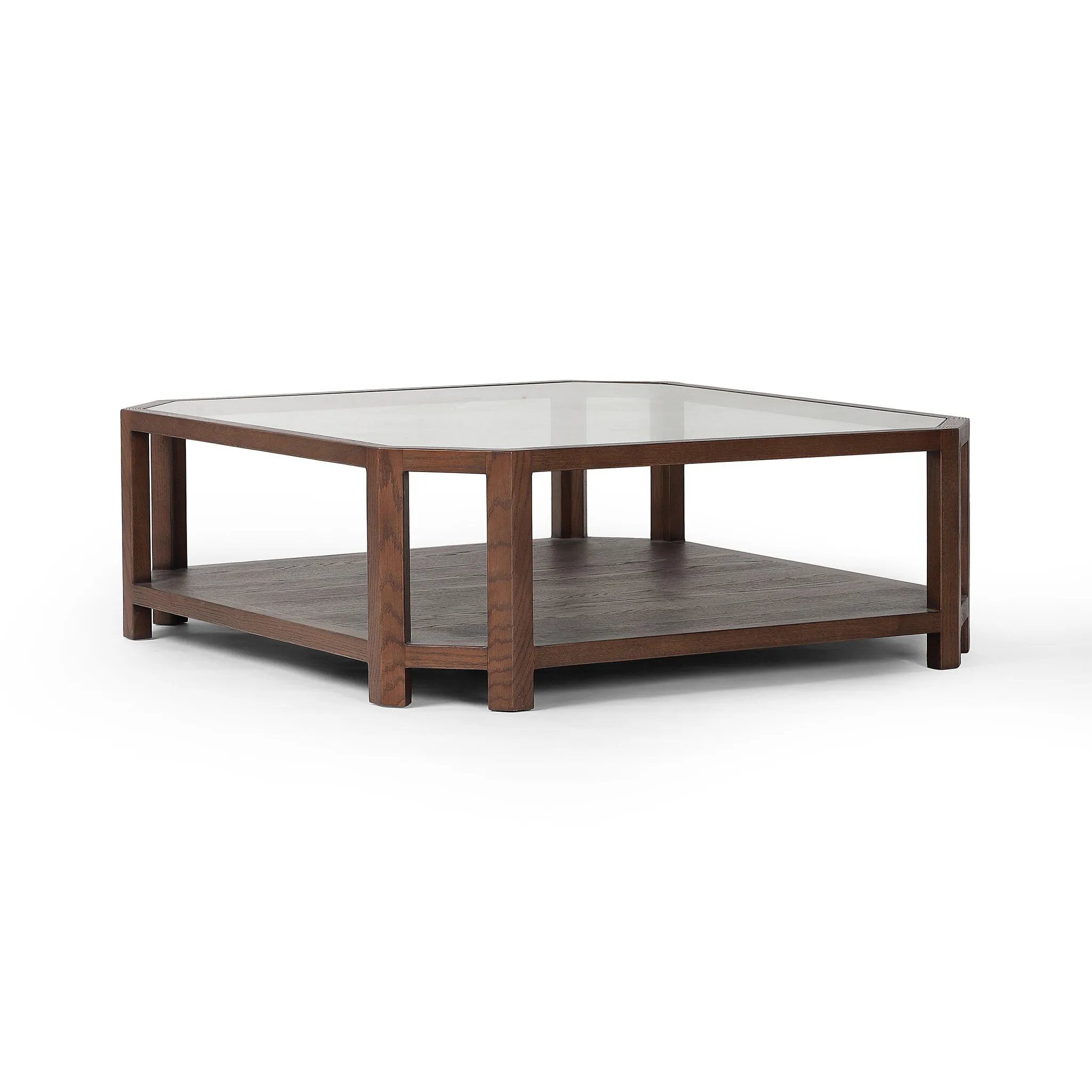 Featuring Jenzen Tempered Glass Coffee Table by Four Hands at Amethyst Home. Mix materials for a timeless look. Warm, brown oak shapes a unique octagon frame for a tempered glass top. Lower open shelving brings bonus storage and display options to your living space. Overall Dimensions: 48.00"w x 48.00"d x 16.50"h. Amethyst Home provides interior design, new home construction design consulting, vintage area rugs, and lighting in the Houston metro area.