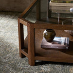 Featuring Jenzen Tempered Glass Coffee Table by Four Hands at Amethyst Home. Mix materials for a timeless look. Warm, brown oak shapes a unique octagon frame for a tempered glass top. Lower open shelving brings bonus storage and display options to your living space. Overall Dimensions: 48.00"w x 48.00"d x 16.50"h. Amethyst Home provides interior design, new home construction design consulting, vintage area rugs, and lighting in the Salt Lake City metro area.