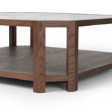 Featuring Jenzen Tempered Glass Coffee Table by Four Hands at Amethyst Home. Mix materials for a timeless look. Warm, brown oak shapes a unique octagon frame for a tempered glass top. Lower open shelving brings bonus storage and display options to your living space. Overall Dimensions: 48.00"w x 48.00"d x 16.50"h. Amethyst Home provides interior design, new home construction design consulting, vintage area rugs, and lighting in the Tampa metro area.