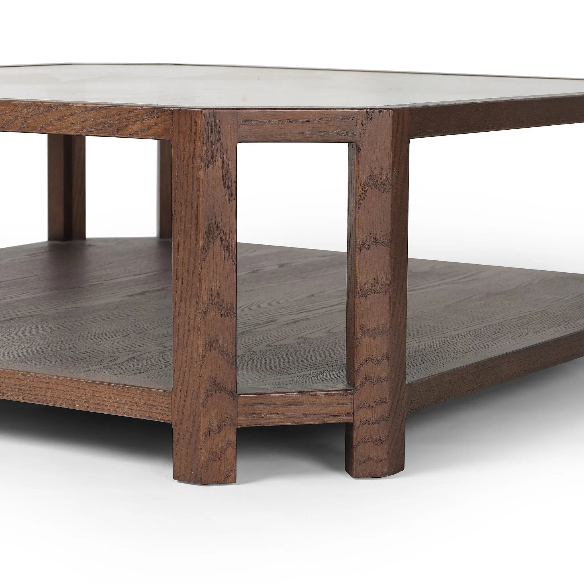 Featuring Jenzen Tempered Glass Coffee Table by Four Hands at Amethyst Home. Mix materials for a timeless look. Warm, brown oak shapes a unique octagon frame for a tempered glass top. Lower open shelving brings bonus storage and display options to your living space. Overall Dimensions: 48.00"w x 48.00"d x 16.50"h. Amethyst Home provides interior design, new home construction design consulting, vintage area rugs, and lighting in the Tampa metro area.