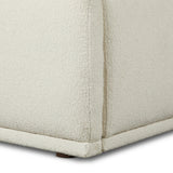 Swooping curves and full upholstery make for an elegant combination. Cream fabric wraps generous cushioning all around, giving textural depth to the bed Amethyst Home provides interior design, new home construction design consulting, vintage area rugs, and lighting in the Calabasas metro area.