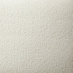 Swooping curves and full upholstery make for an elegant combination. Cream fabric wraps generous cushioning all around, giving textural depth to the bed Amethyst Home provides interior design, new home construction design consulting, vintage area rugs, and lighting in the Dallas metro area.