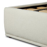 Swooping curves and full upholstery make for an elegant combination. Cream fabric wraps generous cushioning all around, giving textural depth to the bed Amethyst Home provides interior design, new home construction design consulting, vintage area rugs, and lighting in the Houston metro area.