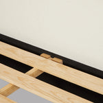 Swooping curves and full upholstery make for an elegant combination. Cream fabric wraps generous cushioning all around, giving textural depth to the bed Amethyst Home provides interior design, new home construction design consulting, vintage area rugs, and lighting in the Nashville metro area.