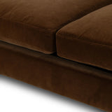 Float-style this unique sofa in a room to show off design details like sleek lines and rear cutouts. Designed with S spring construction, foam and fiber seat cushioning and loose feather-blend back cushions. Upholstered in a soft, velvety cotton in a rich chocolate brown Amethyst Home provides interior design, new home construction design consulting, vintage area rugs, and lighting in the Los Angeles metro area.