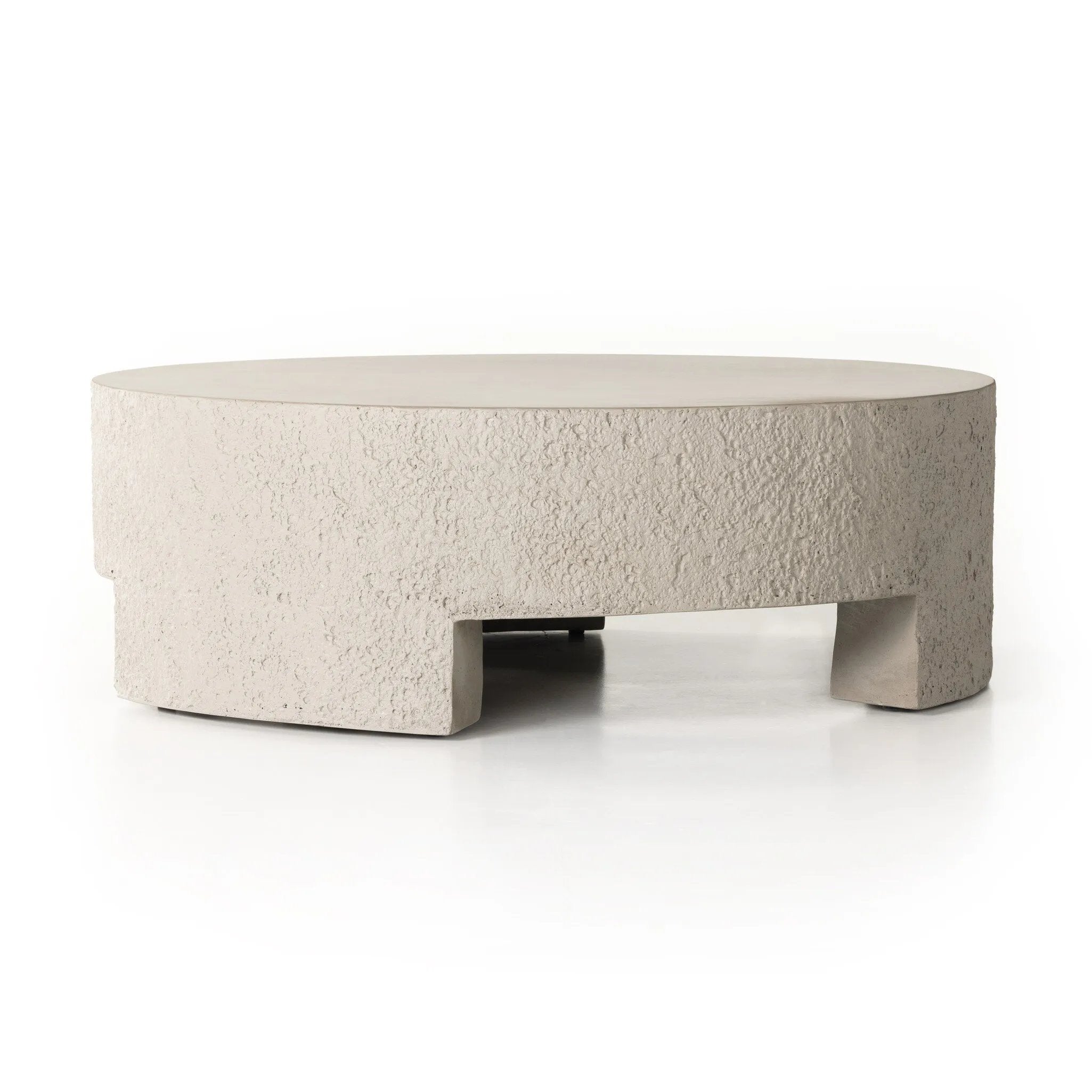 Featuring Everett Matte Stone Outdoor Coffee Table by Four Hands at Amethyst Home. A textured, white concrete coffee table perfect for modern and wabi sabi style.  The table has a matte texture and is perfect for indoors or outdoors.Overall Dimensions: 48.00"w x 48.00"d x 16.25"hWeight : 277.78 lbsMaterials : Concrete. Amethyst Home provides interior design, new home construction design consulting, vintage area rugs, and lighting in the Austin metro area.