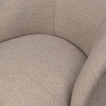 Low in profile with tight, impeccable tailoring, a 360-degree swivel chair is upholstered in a neutral performance fabric that works into a range of spaces and styles with ease. Foam cushioning and S-spring suspension ensures comfort. Amethyst Home provides interior design, new home construction design consulting, vintage area rugs, and lighting in the Tampa metro area.