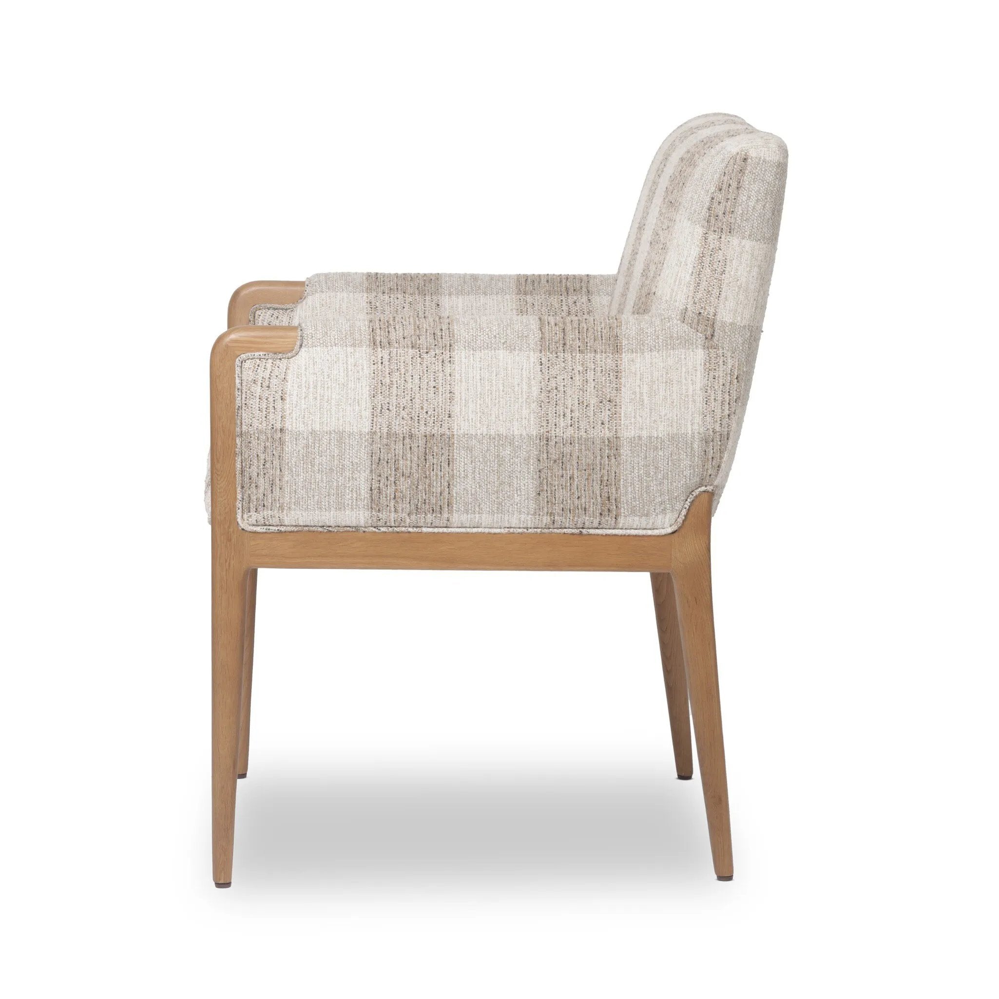 Featuring Ledger Dresden Pebble Dining Chair by Four Hands at Amethyst Home. A patterned dining chair that’s all about comfort. Checkered-print upholstery is framed by light, warm oak, while a boxy profile and higher arms feel prime for the head of the table. Overall Dimensions: 24.50"w x 26.00"d x 33.25"h. Amethyst Home provides interior design, new home construction design consulting, vintage area rugs, and lighting in the Alpharetta metro area.