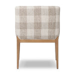 Featuring Ledger Dresden Pebble Dining Chair by Four Hands at Amethyst Home. A patterned dining chair that’s all about comfort. Checkered-print upholstery is framed by light, warm oak, while a boxy profile and higher arms feel prime for the head of the table. Overall Dimensions: 24.50"w x 26.00"d x 33.25"h. Amethyst Home provides interior design, new home construction design consulting, vintage area rugs, and lighting in the Boston metro area.