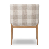 Featuring Ledger Dresden Pebble Dining Chair by Four Hands at Amethyst Home. A patterned dining chair that’s all about comfort. Checkered-print upholstery is framed by light, warm oak, while a boxy profile and higher arms feel prime for the head of the table. Overall Dimensions: 24.50"w x 26.00"d x 33.25"h. Amethyst Home provides interior design, new home construction design consulting, vintage area rugs, and lighting in the Boston metro area.