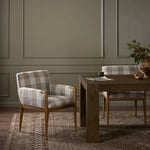 Featuring Ledger Dresden Pebble Dining Chair by Four Hands at Amethyst Home. A patterned dining chair that’s all about comfort. Checkered-print upholstery is framed by light, warm oak, while a boxy profile and higher arms feel prime for the head of the table. Overall Dimensions: 24.50"w x 26.00"d x 33.25"h. Amethyst Home provides interior design, new home construction design consulting, vintage area rugs, and lighting in the Nashville metro area.