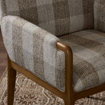 Featuring Ledger Dresden Pebble Dining Chair by Four Hands at Amethyst Home. A patterned dining chair that’s all about comfort. Checkered-print upholstery is framed by light, warm oak, while a boxy profile and higher arms feel prime for the head of the table. Overall Dimensions: 24.50"w x 26.00"d x 33.25"h. Amethyst Home provides interior design, new home construction design consulting, vintage area rugs, and lighting in the Seattle metro area.