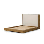 A woven, cushioned headboard in neutral cream adds texture around a floating platform base of light oak. Base features angular chamfered details, thick rails and footboard with a plinth base. Performance fabrics are specially created to withstand spills, stains, high traffic and wear, ensuring long-term comfort and unmatched durability Amethyst Home provides interior design, new home construction design consulting, vintage area rugs, and lighting in the Seattle metro area.