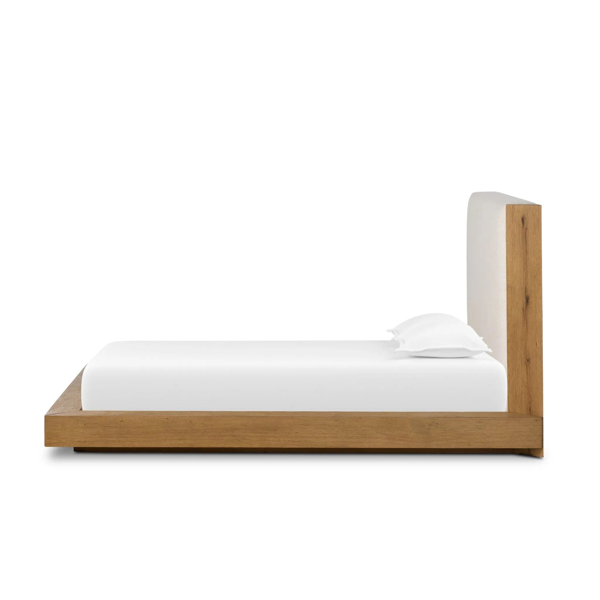 A woven, cushioned headboard in neutral cream adds texture around a floating platform base of light oak. Base features angular chamfered details, thick rails and footboard with a plinth base. Performance fabrics are specially created to withstand spills, stains, high traffic and wear, ensuring long-term comfort and unmatched durability Amethyst Home provides interior design, new home construction design consulting, vintage area rugs, and lighting in the Winter Garden metro area.
