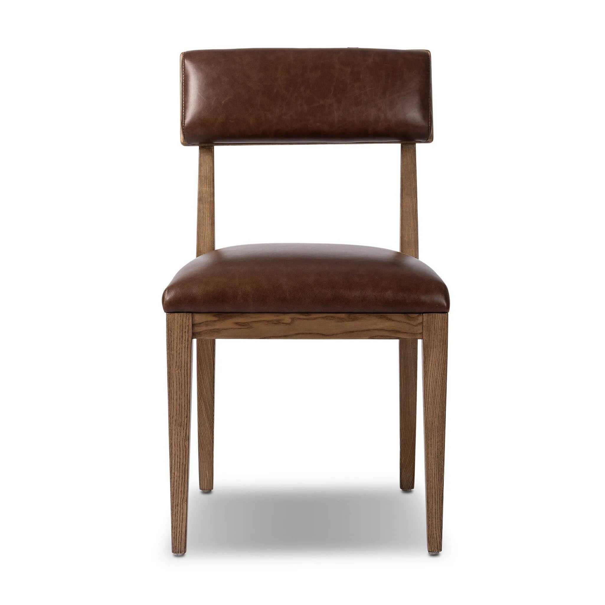 Both modern and traditional, toasted oak frames this high-back, armless dining chair. Finished with a rich brown top-grain leather, with hanging straps affixed to the back Amethyst Home provides interior design, new home construction design consulting, vintage area rugs, and lighting in the Austin metro area.