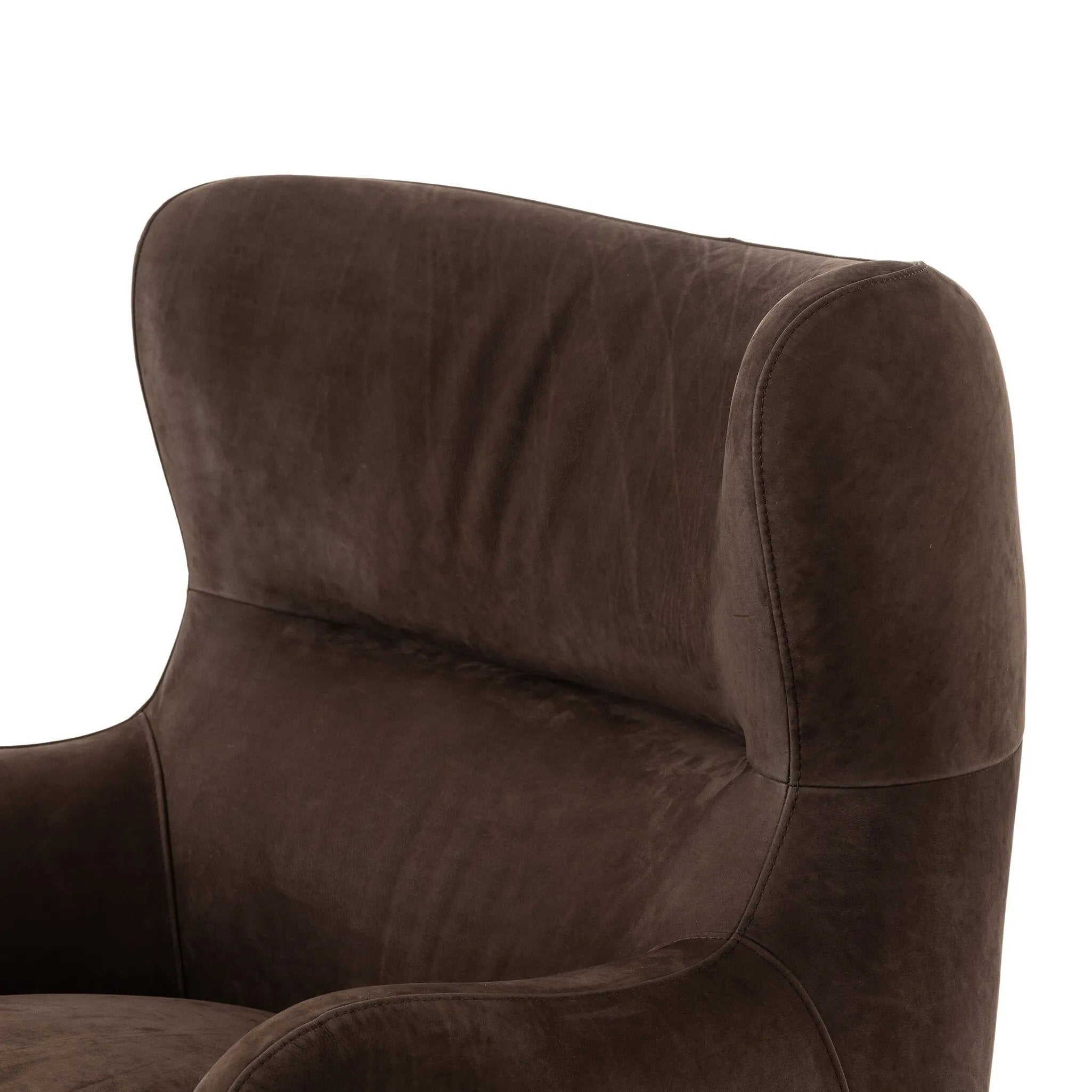 Modern wingback with a twist of barrel back design, this enveloping swivel chair comes with velvety upholstery in a deep brow