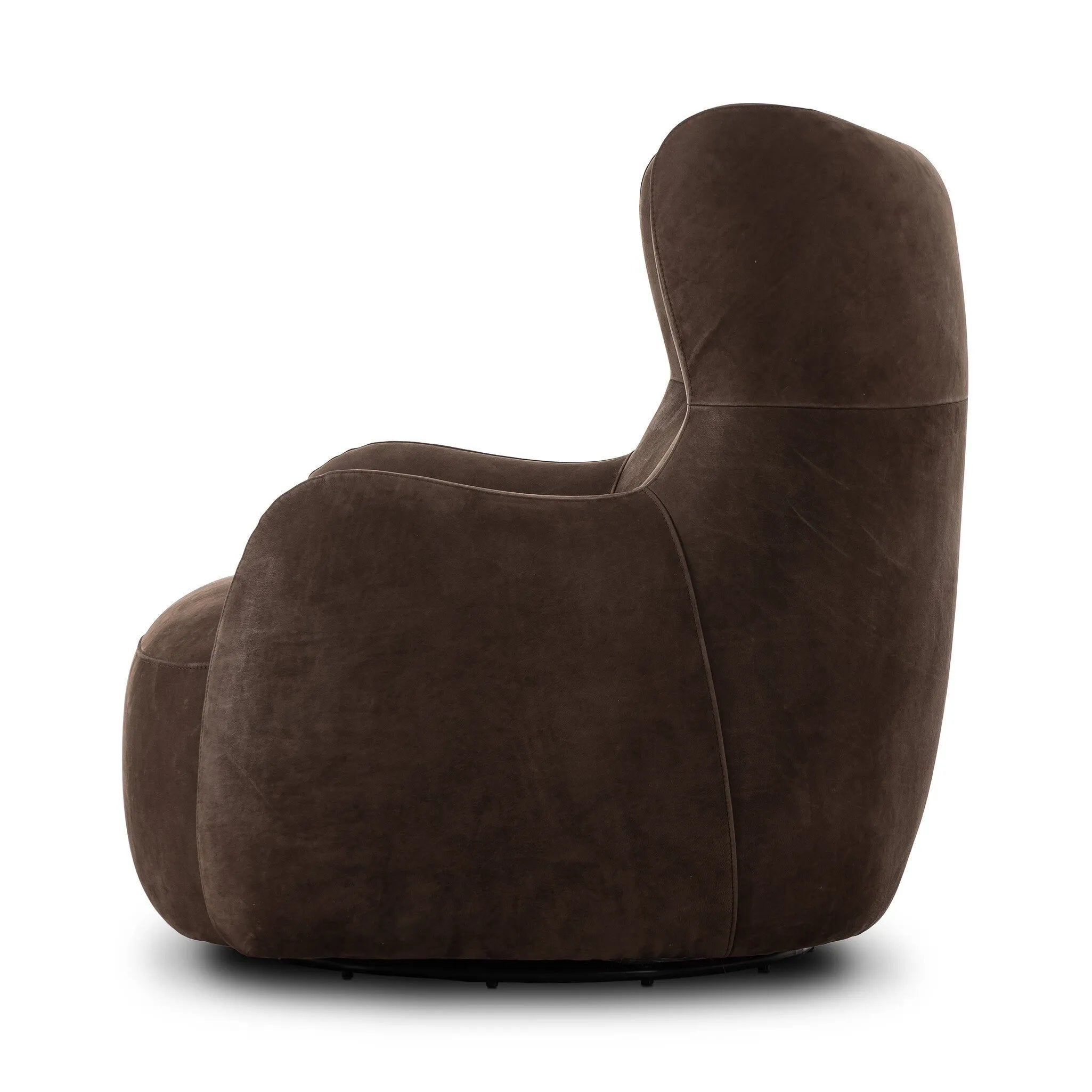 Modern wingback with a twist of barrel back design, this enveloping swivel chair comes with velvety upholstery in a deep brown hue. Deeply cushioned back and seating for maximum comfort, the chair is affixed to a 360-degree swivel base for relaxed lounging Amethyst Home provides interior design, new home construction design consulting, vintage area rugs, and lighting in the Houston metro area.