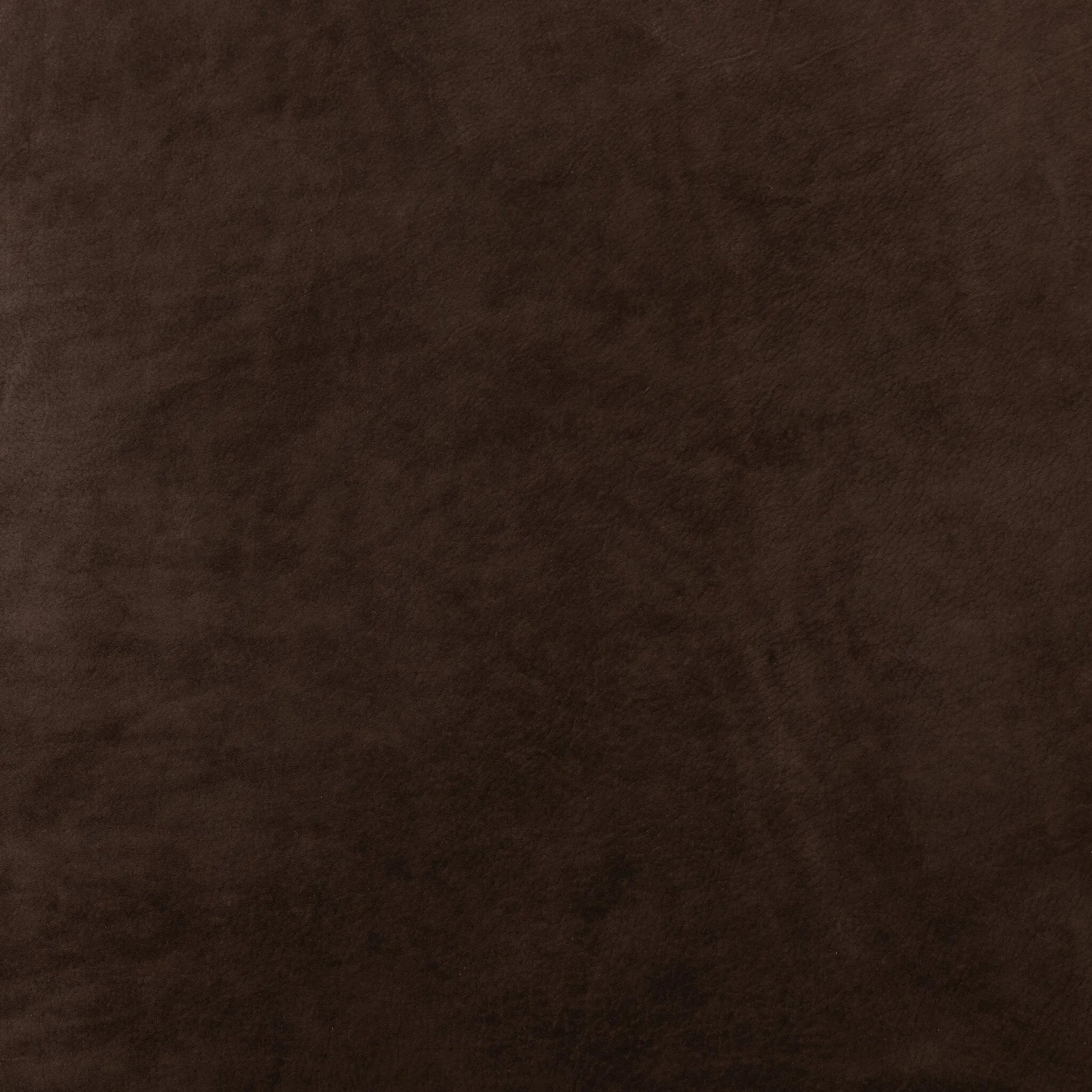 Modern wingback with a twist of barrel back design, this enveloping swivel chair comes with velvety upholstery in a deep brow