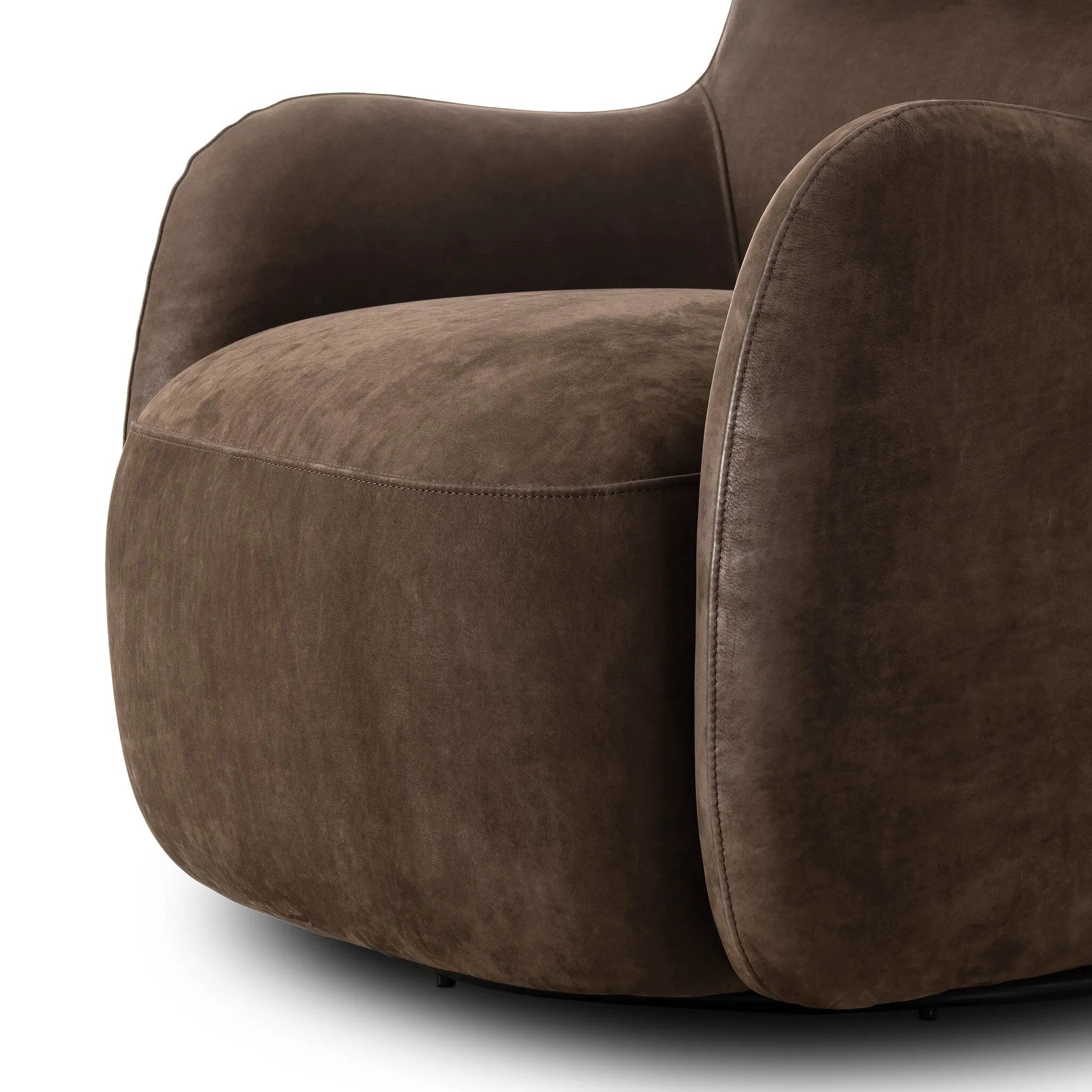 Modern wingback with a twist of barrel back design, this enveloping swivel chair comes with velvety upholstery in a deep brown hue. Deeply cushioned back and seating for maximum comfort, the chair is affixed to a 360-degree swivel base for relaxed lounging Amethyst Home provides interior design, new home construction design consulting, vintage area rugs, and lighting in the Scottsdale metro area.