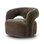 Featuring Mazie Monte Olive Swivel Chair by Four Hands at Amethyst Home. A fluid play on seating. This statement-making swivel chair features subtle cutouts on the back, with plush arms that hug the seat. Upholstered in an olive faux wool-mohair, bringing a plush moment to a classic frame.Overall Dimensions: 36.00"w x 32.00"d x 28.50"hWeight : 71.65 lbsMaterial. Amethyst Home provides interior design, new home construction design consulting, vintage area rugs, and lighting in the Omaha metro area.