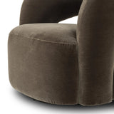 Featuring Mazie Monte Olive Swivel Chair by Four Hands at Amethyst Home. A fluid play on seating. This statement-making swivel chair features subtle cutouts on the back, with plush arms that hug the seat. Upholstered in an olive faux wool-mohair, bringing a plush moment to a classic frame.Overall Dimensions: 36.00"w x 32.00"d x 28.50"hWeight : 71.65 lbs. Amethyst Home provides interior design, new home construction design consulting, vintage area rugs, and lighting in the Winter Garden metro area.