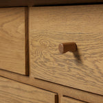 Drawing inspiration from a vintage general store counter, a storage-driven dresser reflects traditional and functional design. Thick oak legs with softened corners provide sturdy support, while oak knobs add a classic touch. An inset tray top and a versatile drawer configuration offer ample storage Amethyst Home provides interior design, new home construction design consulting, vintage area rugs, and lighting in the Tampa metro area.